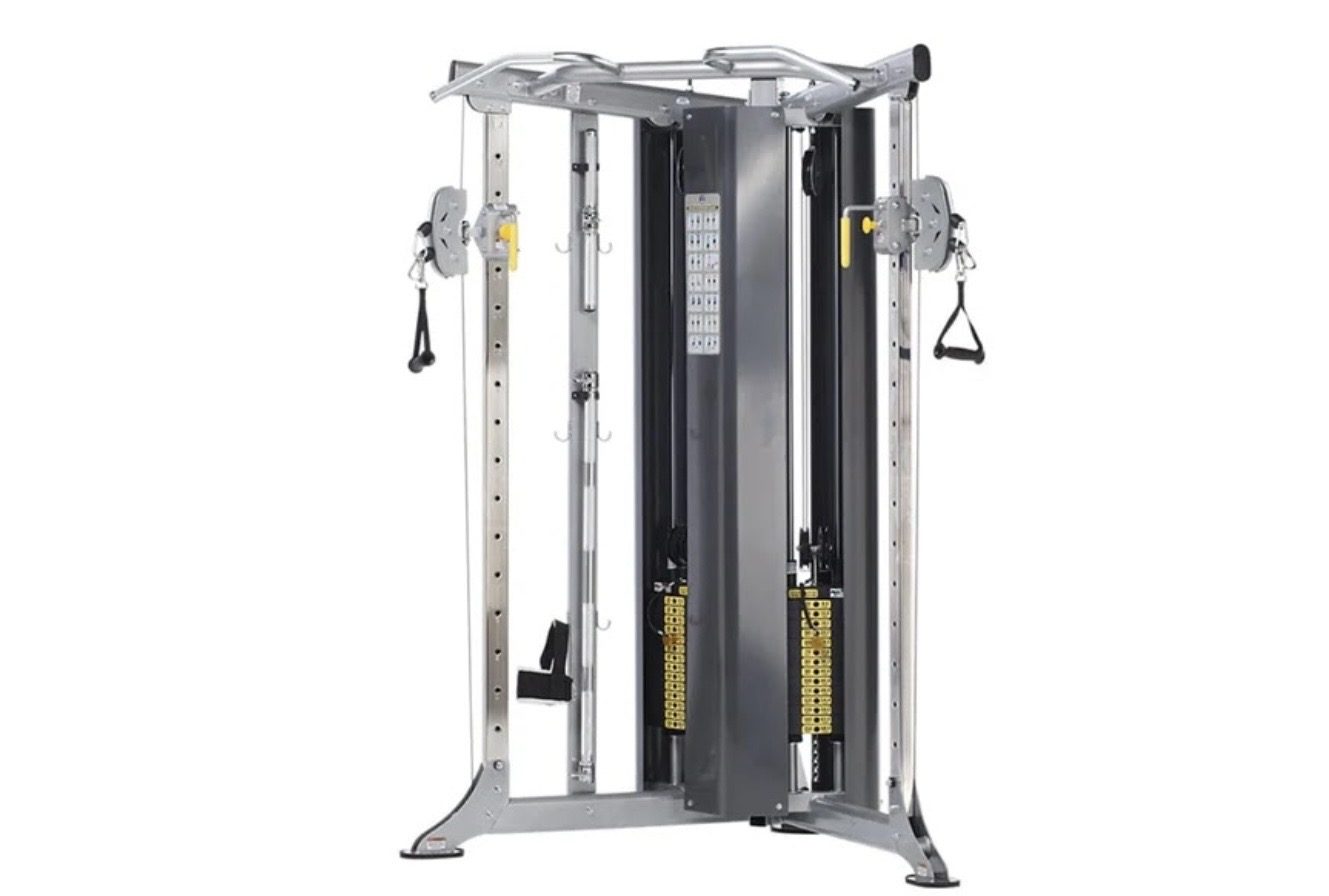 TuffStuff commercial strength equipment — Evolution functional trainer with dual stacks and adjustable pulleys —