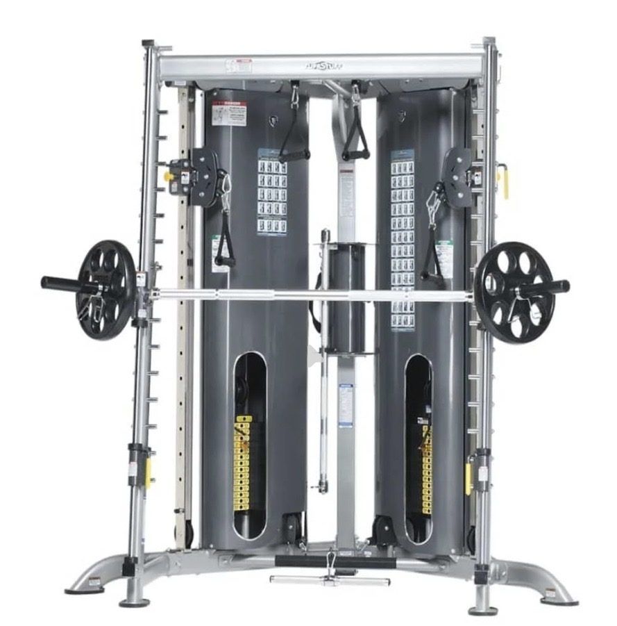 TuffStuff commercial strength equipment — Dual weight stacks, a Smith bar and integrated plate storage in a sing