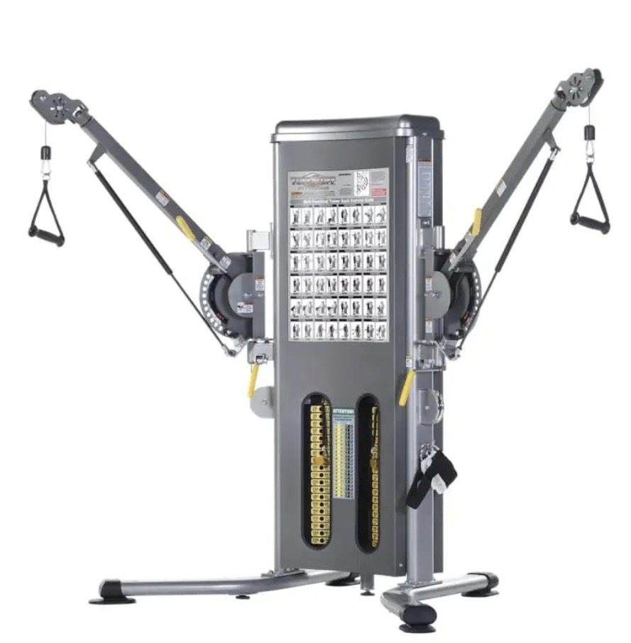 TuffStuff multi-functional trainer with dual weight stacks and exercise placard