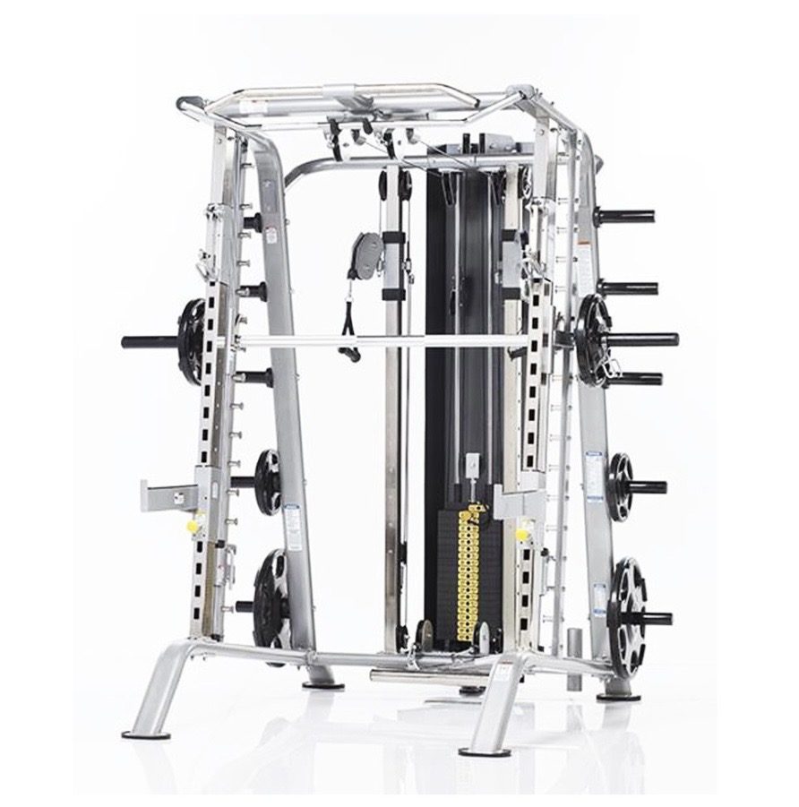 TuffStuff commercial strength equipment — The same combo unloaded. Plate horns on both sides keep weights off th