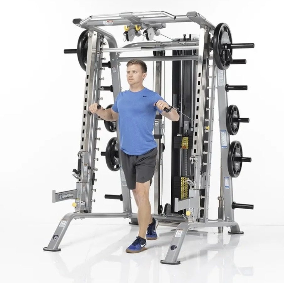 TuffStuff commercial strength equipment — Cable work on the same frame. Adjustable pulleys mean one unit covers 
